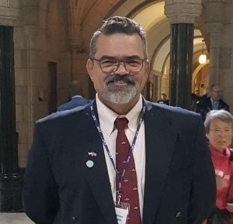 Portrait of Matthew Harper in a suit and tie